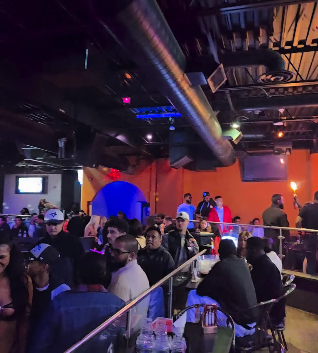 Guest tables and raised seating inside Whiskey A Go-Go.